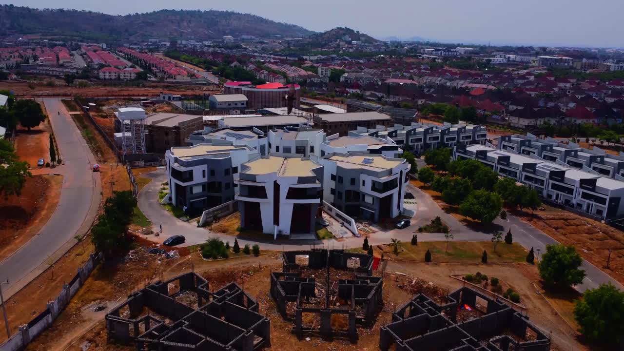 White rooftops and neat streets highlight exclusive estates in Lifecamp Abuja