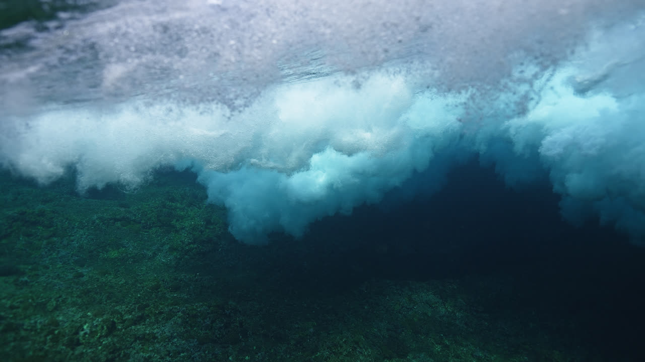 Underwater Waves Crashing Over Coral Reef