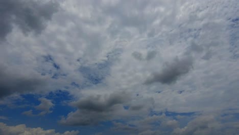 Time-lapse-showing-clouds-formation-moving-fast-covering-the-blue-sky