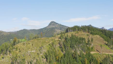 Aerial-drone-view-of-mountain-range-track-with-peak-on-background