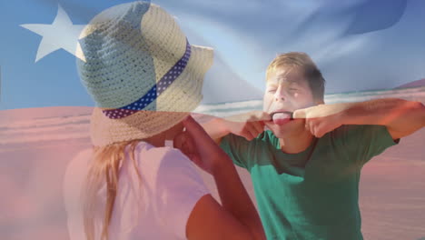 at beach, two children making funny faces with chilean flag animation overlay