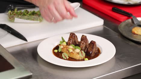 chef preparing a gourmet lamb dish