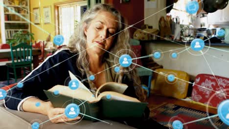 animation of network of connections with icons over senior caucasian woman reading