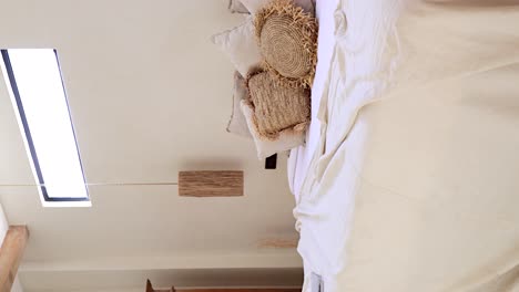 vertical panning inside bali villa room with king bed decorated in bohemian style