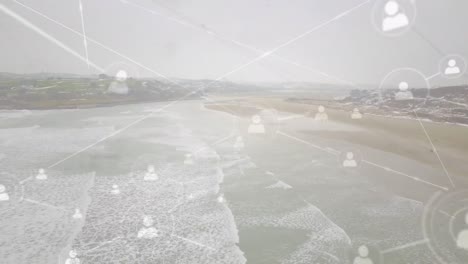 animation of network of connections with icons over sea landscape