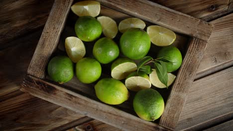 fresh limes on a tray rotate slowly.