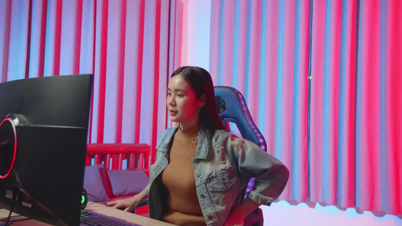 Young Asian Gamer Girl Start Playing Video Game On Computer