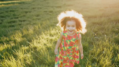 happy little girl in a colorful dress