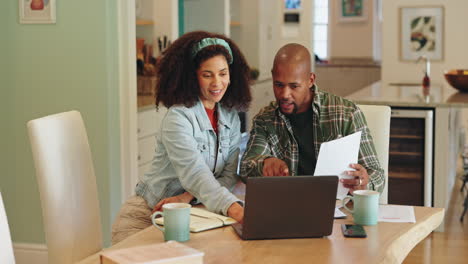 couple working together at home on finances