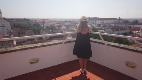 woman looking at view of historic city evora
