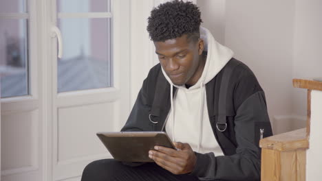 portrait of smiling young man communicating in online chat