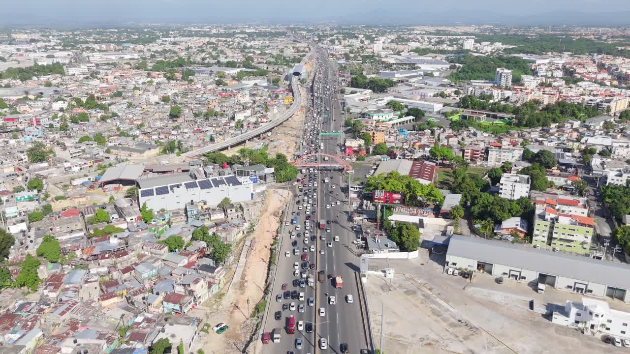 Work in progress for construction of Kilometer 9 of Duarte highway, Santo Domingo city, Dominican Republic. Aerial forward