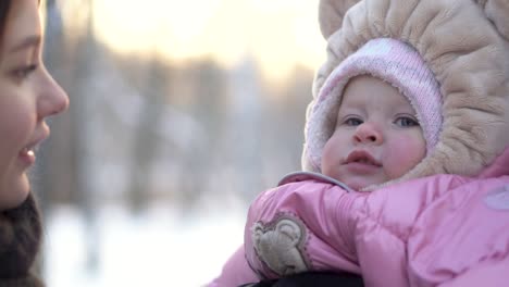 mother and baby in winter park