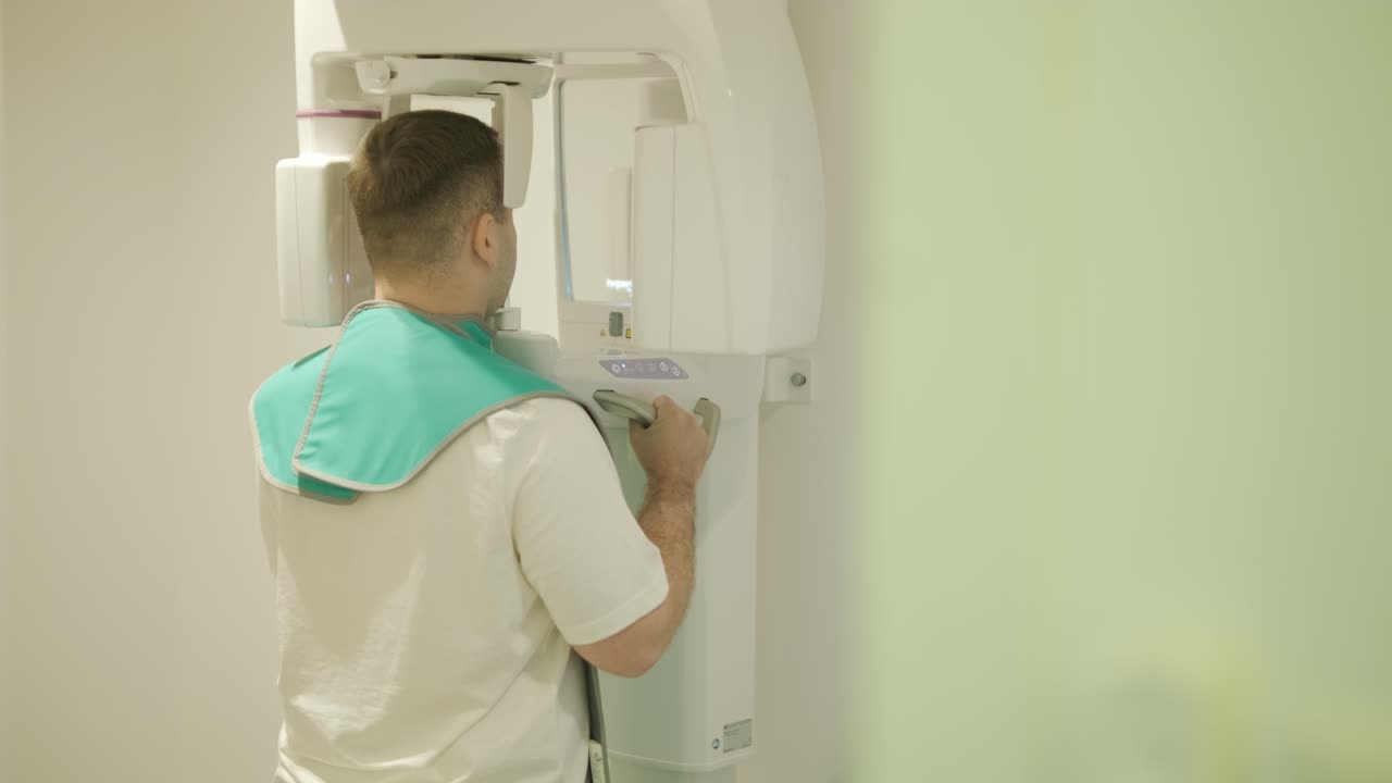 Patient Undergoing Dental X-Ray with Technician
