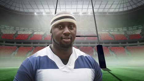 animation of african american male rugby player holding ball over stadium