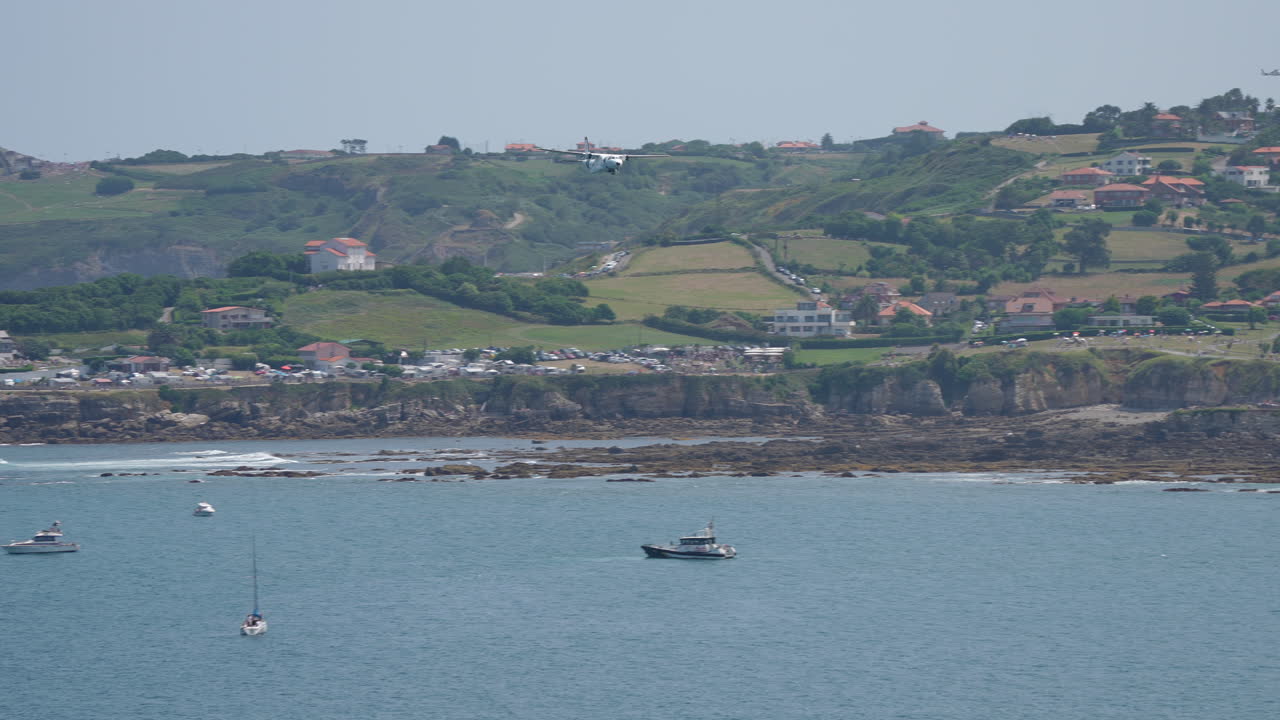 Aerial views of coastal town with airplane