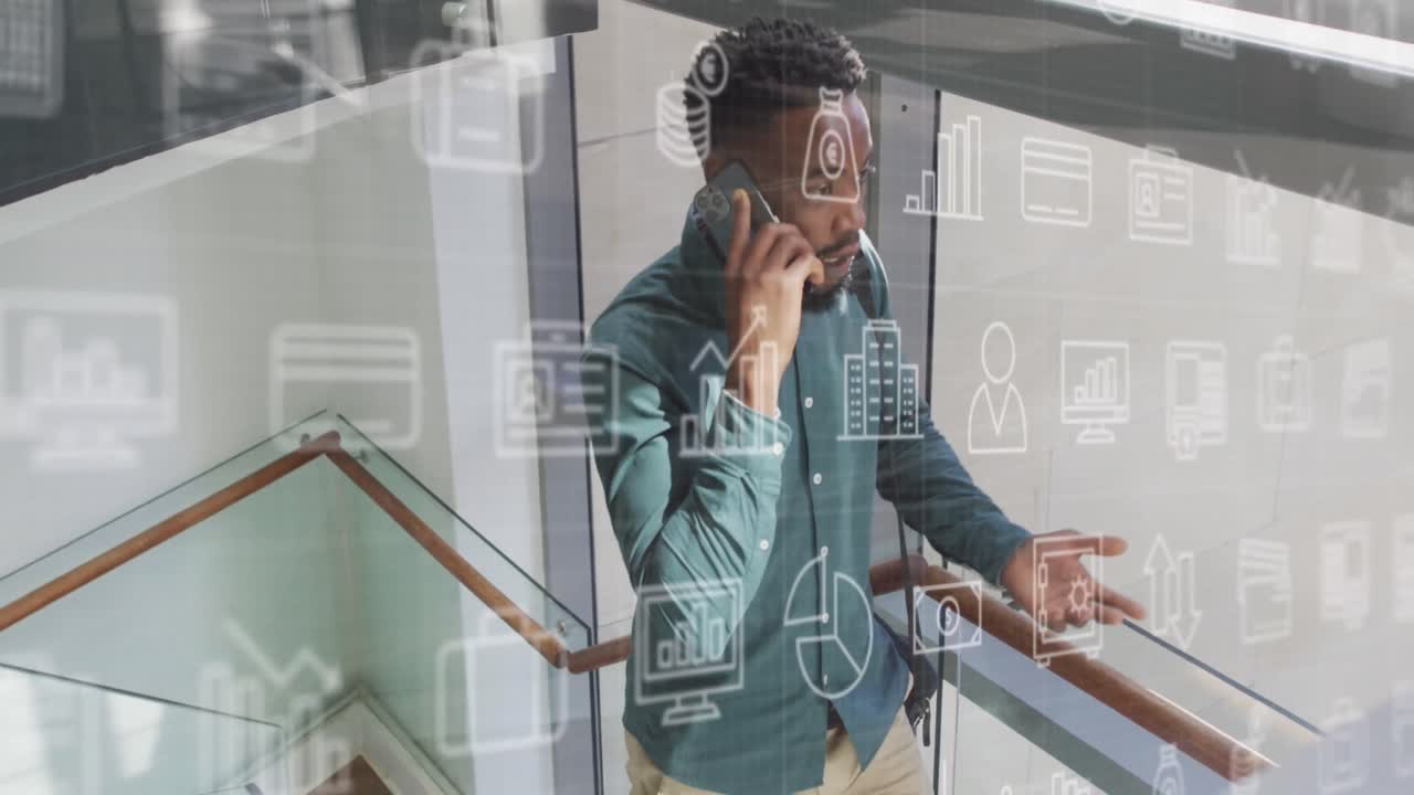 animación de iconos y procesamiento de datos sobre empresario afroamericano en la oficina