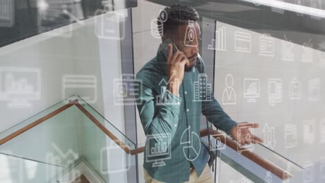 animation of icons and data processing over african american businessman in office