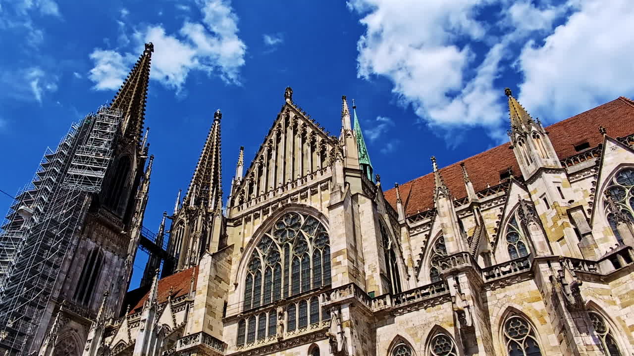 Gothic St. Peter Cathedral in low angle view towards spires in Regensburg, Germany