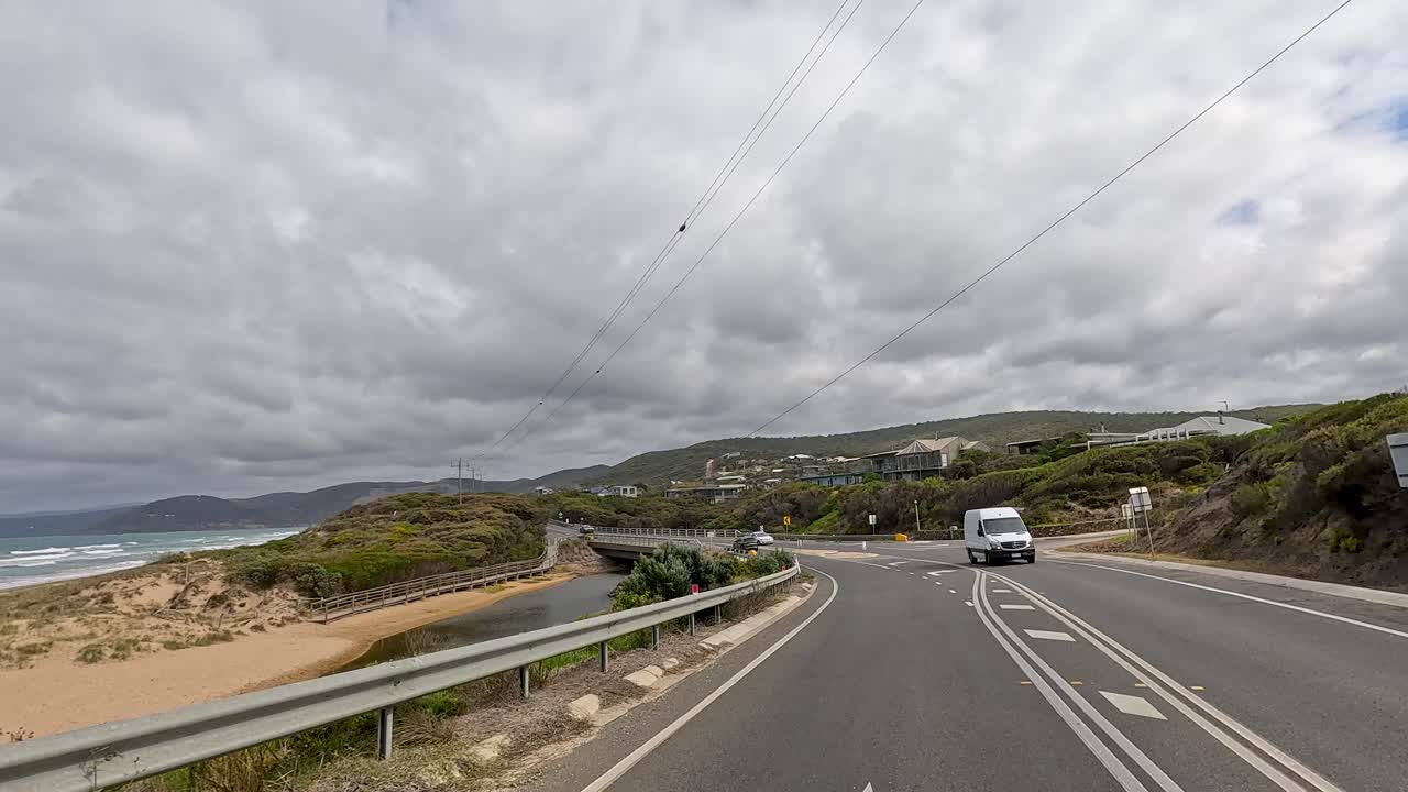 A 45-second journey capturing the coastal beauty and winding roads of Great Ocean Road, Australia, under overcast skies