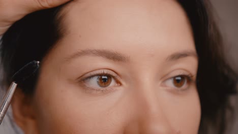 woman getting her eyebrows done