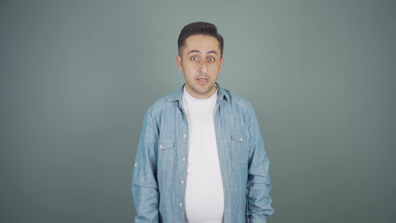 Man looking at camera in amazement.