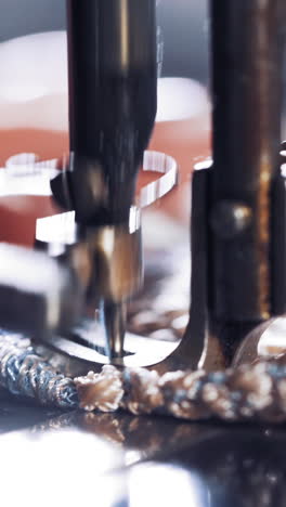 hand on old sewing machine. seamstress making new clothing concept vertical video