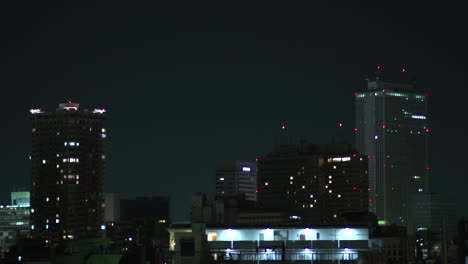 nightly view of high-rise skyscrapers building of tokyo, japan