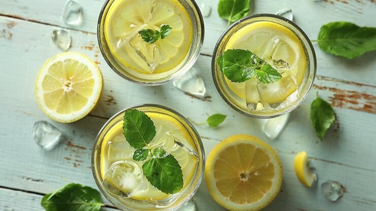 Refreshing Lemon Drinks with Mint on Rustic Wooden Background