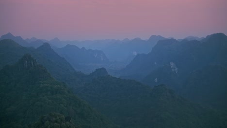 misty sunset over cat ba's mountains silhouette