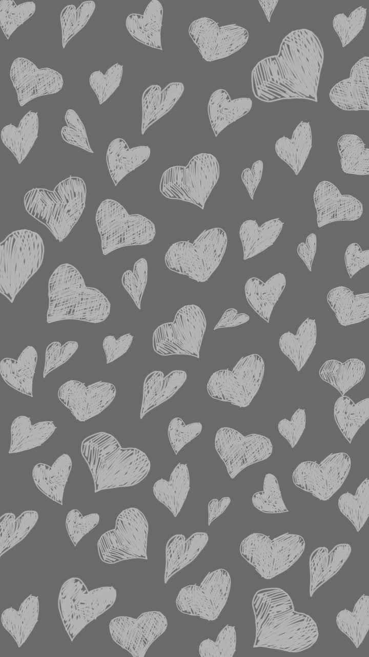 Heart doodles seamless pattern. Love animation hearts hand drawn on grey background. Looped. Vertical video.