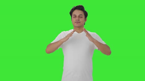 Happy-Indian-man-doing-breathe-in-breathe-out-exercise-Green-screen