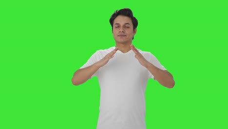 happy indian man doing breathe in breathe out exercise green screen