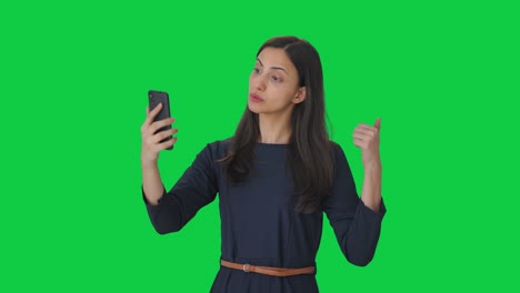 Indian-girl-talking-on-video-call-Green-screen