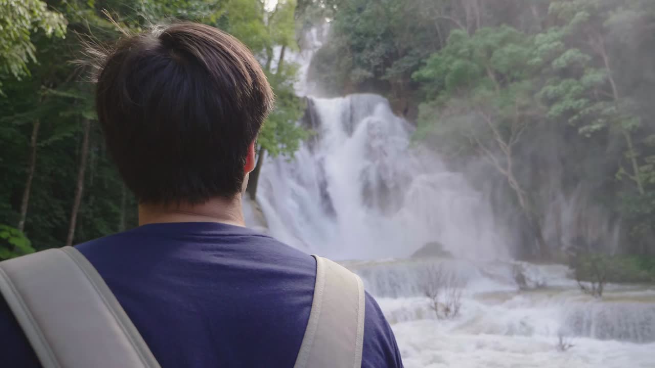 Man Looking At Waterfall, Slow Motion