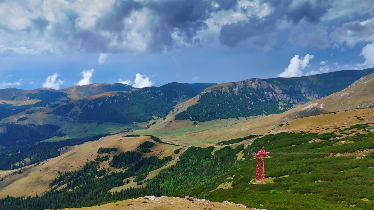 Mountain view with dramatic clouds over Bucegi Plateau. Scenic view of the Bucegi Mountains plateau under cloudy skies