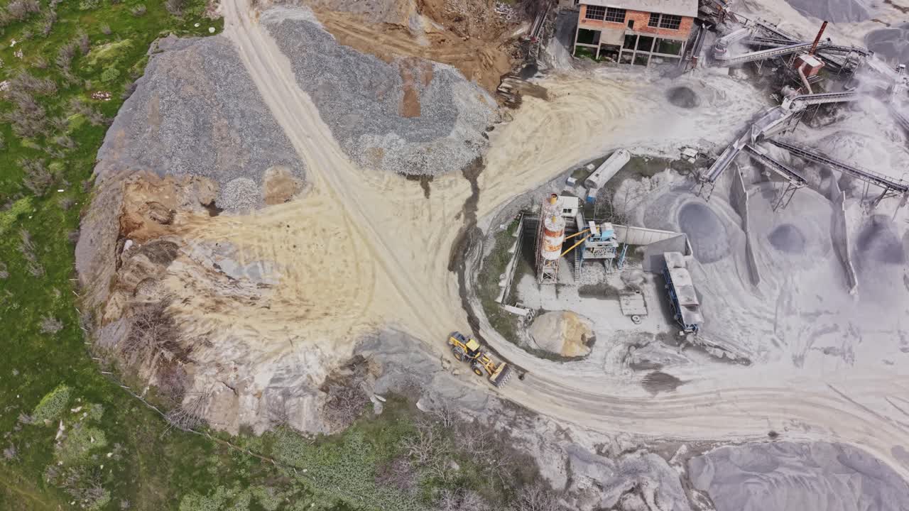 Aerial View of a Large Industrial Quarry with Heavy Machinery