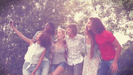 In-high-quality-format-happy-friends-in-the-park-taking-selfie-