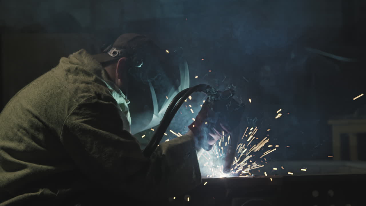 Welder Man Working With Steel At Factory