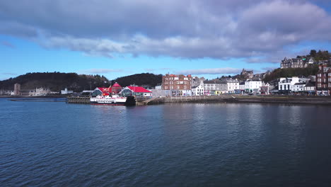 panning shot of the historical buildings in oban in schotland on a sunny day