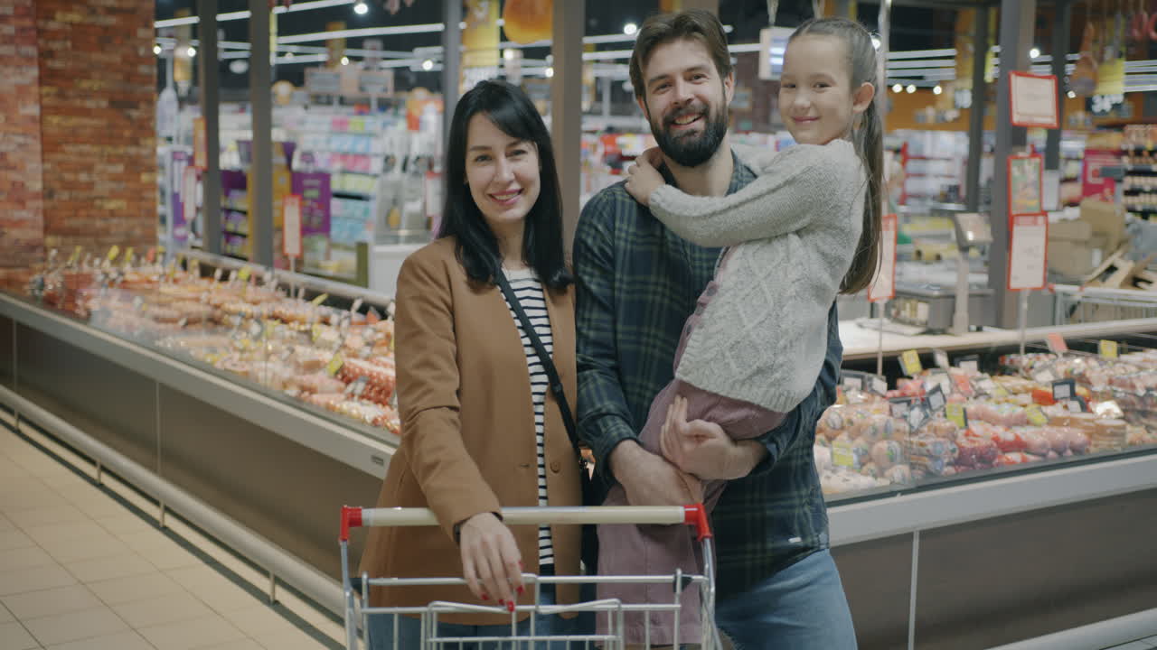 Family Shopping at Supermarket