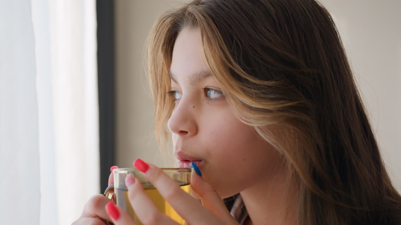 Calm Individual Observing Sunlight Peacefully, Serene Person Calmly Watching Sunlight With Soft Smile, Content Person With Gentle Smile Peacefully Viewing Sunlight While Sipping From Cup