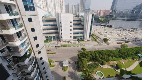 Time-Lapse-Looking-Down-From-a-Building-at-Road-in-Gurugram-Business-District-with-Traffic-Below