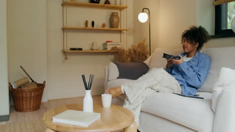 woman relaxing and enjoying leisure time at home