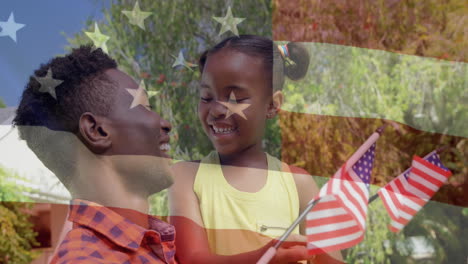 animación de la bandera de los estados unidos sobre un feliz padre y hija afroamericanos con banderas de la ua