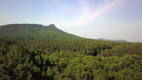 aerial in 4k of pilot mountain in the distance