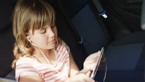 Girl-listening-to-music-on-mobile-phone