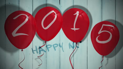 2015 balloons against wooden planks