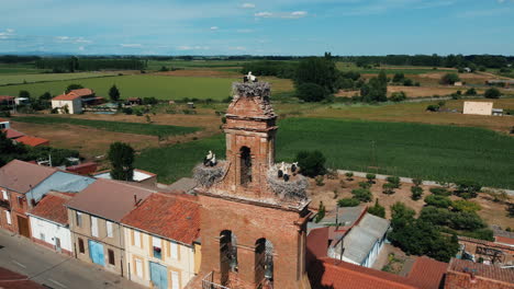 spanish village with storks' nest on bell tower