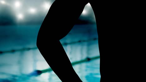 animation of midsection of male swimmer over spotlights and swimming pool